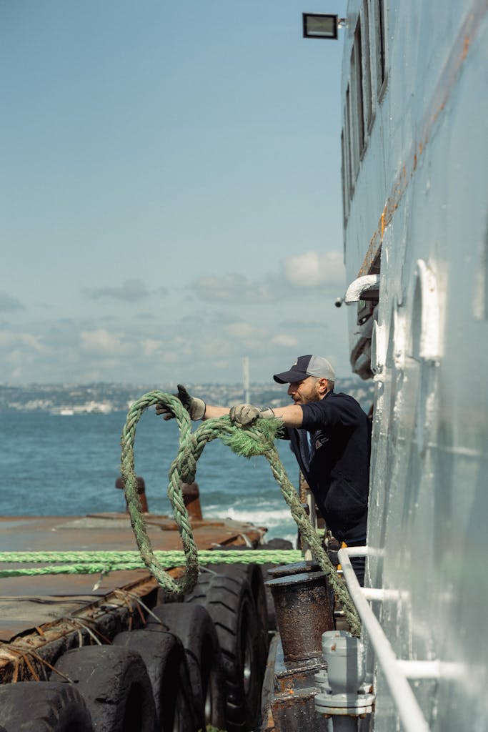 Sailor Mooring Ship on Pier