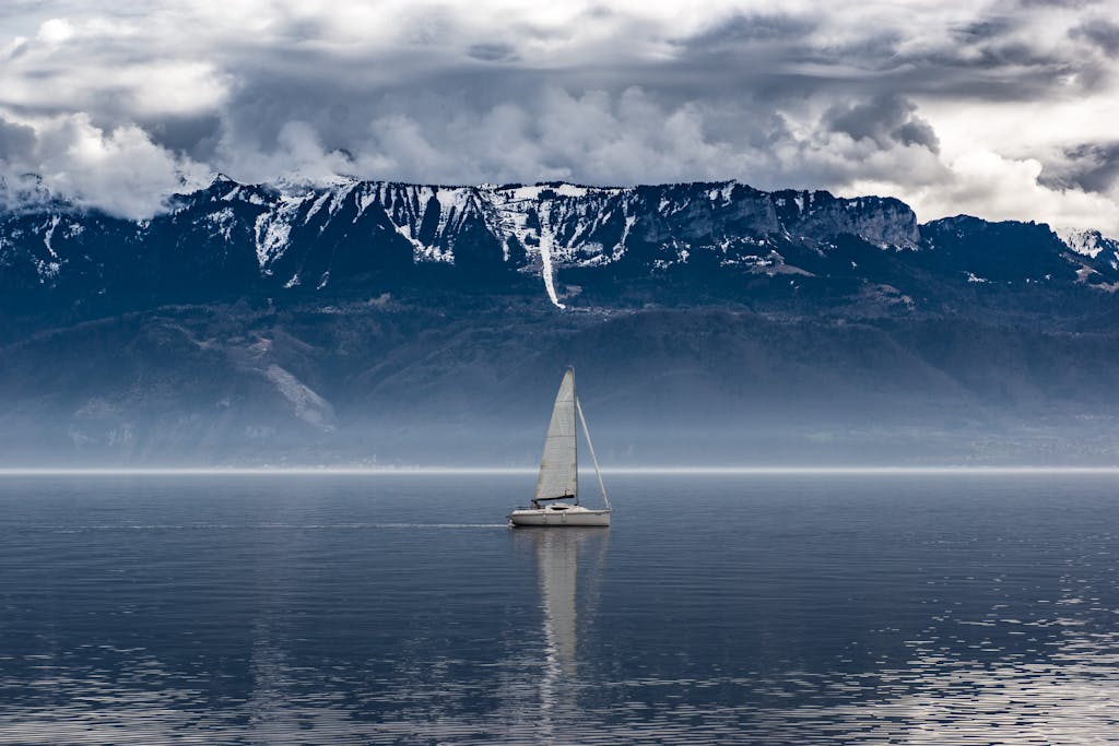 White Sailboat on Body of Water