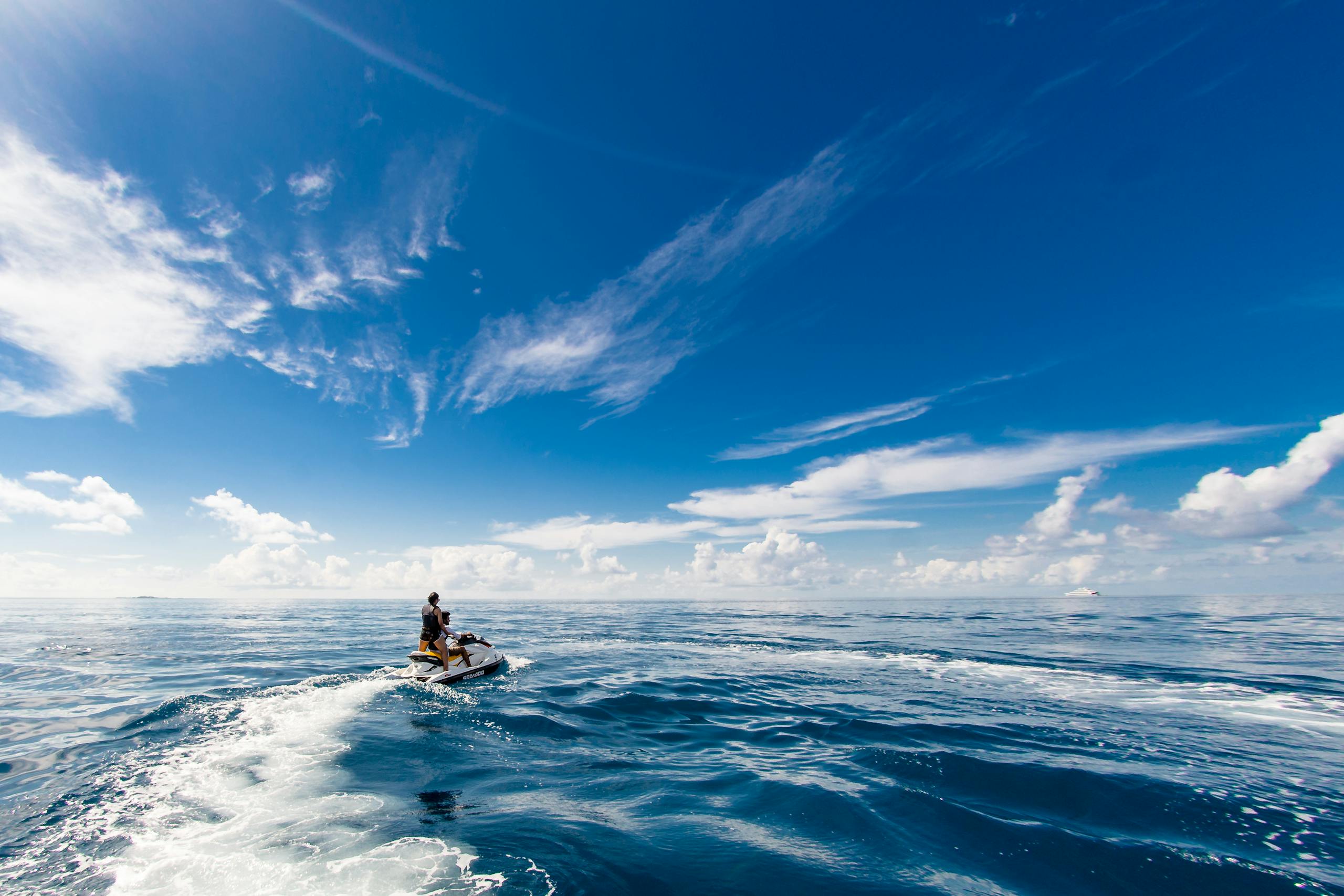 People Riding A Jet Ski