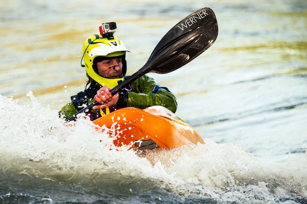 Photo of Man Whitewater Kayaking