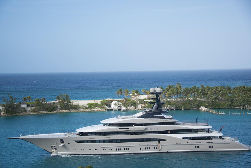 White and Blue Yacht on Body of Water